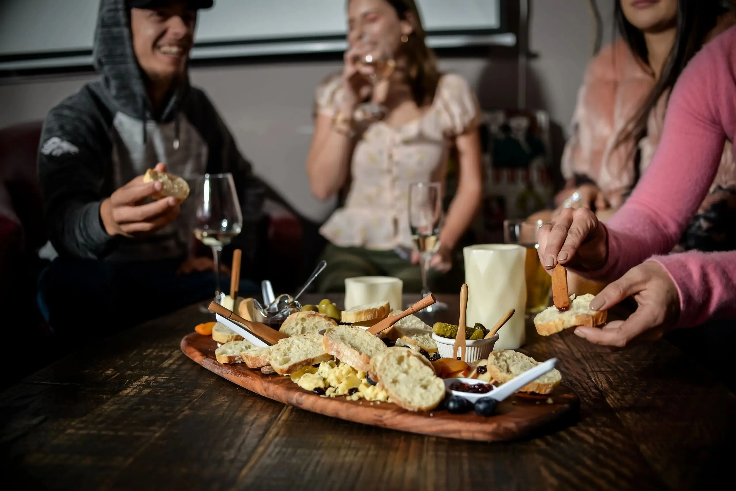 Guests sharing a charcuterie board on date night